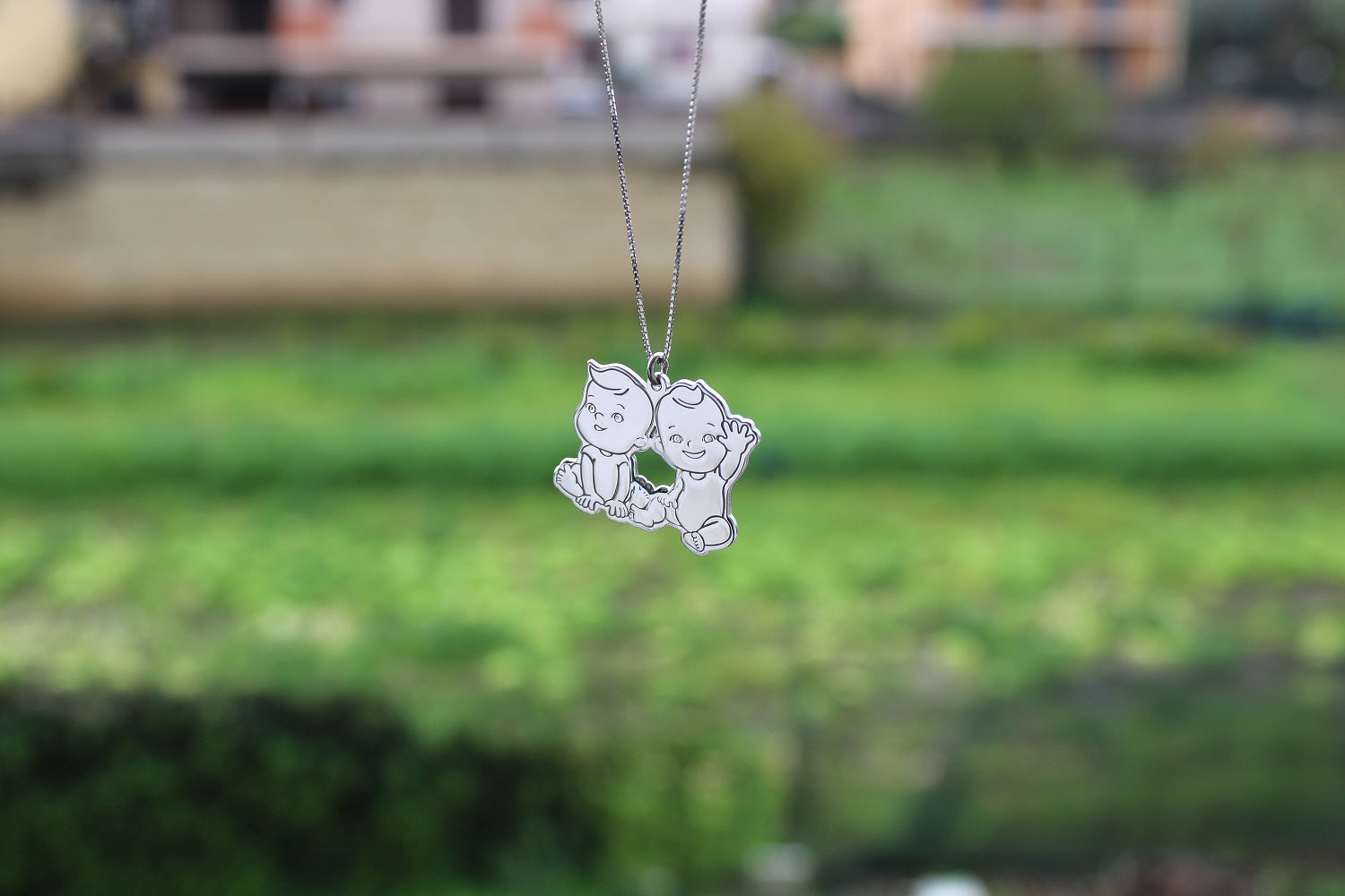 Collana in argento con 2 bambini